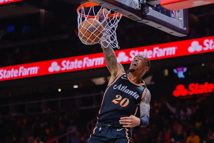 Mar 17, 2023; Atlanta, Georgia, USA; Atlanta Hawks forward John Collins (20) dunks against the Golden State Warriors in the first quarter at State Farm Arena. Mandatory Credit: Brett Davis-USA TODAY Sports