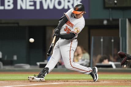 Apr 3, 2023; Arlington, Texas, USA; Baltimore Orioles designated hitter Adley Rutschman (35) hits for a single against the Texas Rangers during the first inning at Globe Life Field. Mandatory Credit: Jim Cowsert-USA TODAY Sports