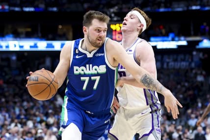 Apr 5, 2023; Dallas, Texas, USA;  Dallas Mavericks guard Luka Doncic (77) drives to the basket as Sacramento Kings guard Kevin Huerter (9) defends during the second quarter at American Airlines Center. Mandatory Credit: Kevin Jairaj-USA TODAY Sports