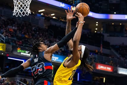 Apr 7, 2023; Indianapolis, Indiana, USA; Indiana Pacers forward Isaiah Jackson (22) shoots the ball while  Detroit Pistons guard Jaden Ivey (23) defends in the first half at Gainbridge Fieldhouse. Mandatory Credit: Trevor Ruszkowski-USA TODAY Sports