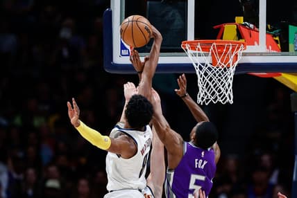 Apr 9, 2023; Denver, Colorado, USA; Denver Nuggets forward Peyton Watson (8) blocks the shot attempt of Sacramento Kings guard De'Aaron Fox (5) in the second quarter at Ball Arena. Mandatory Credit: Isaiah J. Downing-USA TODAY Sports