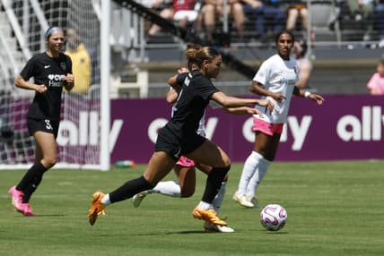 May 6, 2023; Washington, DC, USA; Washington Spirit forward Trinity Rodman (2) is defended by San Diego Wave FC midfielder Danielle Colaprico (24) in a NWSL game at Audi Field. Mandatory Credit: Geoff Burke-USA TODAY Sports