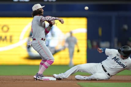 May 14, 2023; Miami, Florida, USA;  Cincinnati Reds second baseman Jonathan India (6) attempts to complete a double play after getting the force out at second base of Miami Marlins first baseman Garrett Cooper (26) in the first inning at loanDepot Park. Mandatory Credit: Jim Rassol-USA TODAY Sports