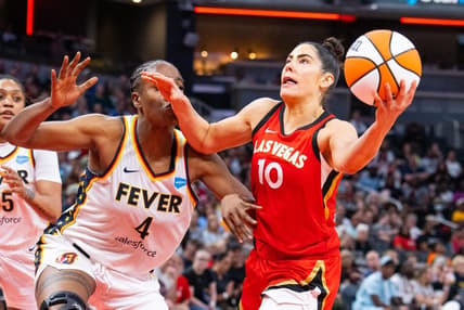 Jun 4, 2023; Indianapolis, Indiana, USA; Las Vegas Aces guard Kelsey Plum (10) shoots the ball while Indiana Fever center Queen Egbo (4) defends in the second half at Gainbridge Fieldhouse. Mandatory Credit: Trevor Ruszkowski-USA TODAY Sports