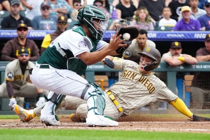Jun 10, 2023; Denver, Colorado, USA; San Diego Padres second baseman Ha-Seong Kim (7) scores against Colorado Rockies catcher Elias Diaz (35) in the sixth inning at Coors Field. Mandatory Credit: Ron Chenoy-USA TODAY Sports