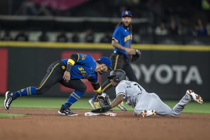 Jun 16, 2023; Seattle, Washington, USA; Chicago White Sox shortstop Tim Anderson (7) steals second against Seattle Mariners second baseman Jose Caballero during the third inning at T-Mobile Park. Mandatory Credit: Stephen Brashear-USA TODAY Sports