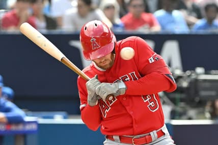Jul 29, 2023; Toronto, Ontario, CAN; Los Angeles Angels left fielder Taylor Ward (3) is struck in the head by a pitch from Toronto Blue Jays pitcher Alek Manoah (not shown) in the fifth inning at Rogers Centre. Mandatory Credit: Dan Hamilton-USA TODAY Sports