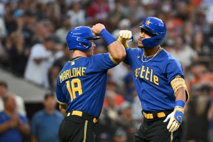 Aug 11, 2023; Seattle, Washington, USA; Seattle Mariners left fielder Cade Marlowe (18) and center fielder Julio Rodriguez (44) celebrate after Rodriguez hit a 3-run home run against the Baltimore Orioles during the fourth inning at T-Mobile Park. Mandatory Credit: Steven Bisig-USA TODAY Sports