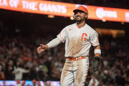 Aug 15, 2023; San Francisco, California, USA;  San Francisco Giants right fielder Michael Conforto (8) smiles after scoring during the eighth inning against the Tampa Bay Rays at Oracle Park. Mandatory Credit: Ed Szczepanski-USA TODAY Sports