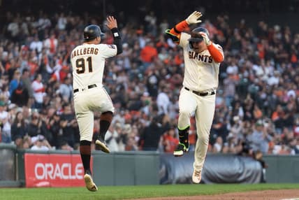 Sep 10, 2023; San Francisco, California, USA;  San Francisco Giants designated hitter Joc Pederson (23) celebrates with third base coach Mark Hallberg (91) after hitting a solo home run during the fifth inning against the Colorado Rockies at Oracle Park. Mandatory Credit: Stan Szeto-USA TODAY Sports