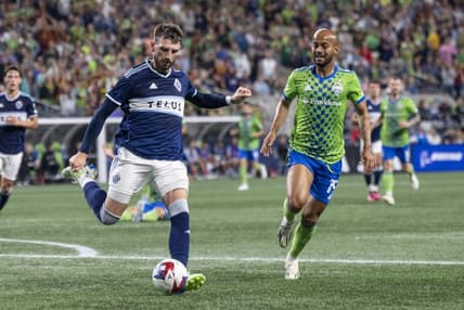 Oct 7, 2023; Seattle, Washington, USA; Vancouver Whitecaps defender Tristan Blackmon (6) passes the ball against Seattle Sounders forward Heber (19) during the second half at Lumen Field. Mandatory Credit: Stephen Brashear-USA TODAY Sports