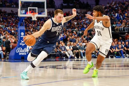 Oct 27, 2023; Dallas, Texas, USA; Dallas Mavericks guard Luka Doncic (77) drives on Brooklyn Nets guard Cam Thomas (24) during the second quarter at American Airlines Center. Mandatory Credit: Andrew Dieb-USA TODAY Sports