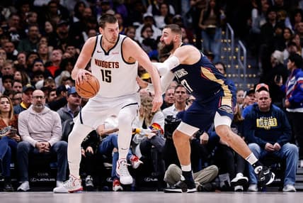 Nov 6, 2023; Denver, Colorado, USA; Denver Nuggets center Nikola Jokic (15) controls the ball as New Orleans Pelicans center Jonas Valanciunas (17) guards in the second quarter at Ball Arena. Mandatory Credit: Isaiah J. Downing-USA TODAY Sports