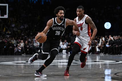Nov 25, 2023; Brooklyn, New York, USA; Brooklyn Nets guard Spencer Dinwiddie (26) drives against Miami Heat forward Jamal Cain (8) during the fourth quarter at Barclays Center. Mandatory Credit: John Jones-USA TODAY Sports