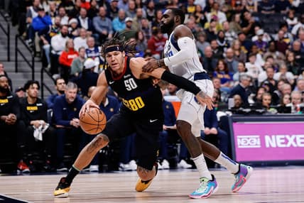 Dec 18, 2023; Denver, Colorado, USA; Denver Nuggets forward Aaron Gordon (50) controls the ball as Dallas Mavericks forward Tim Hardaway Jr. (10) guards in the second quarter at Ball Arena. Mandatory Credit: Isaiah J. Downing-USA TODAY Sports