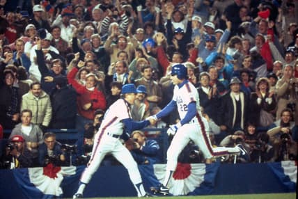 Mets Ray Knight is congratulated by third base coach Bud Harrelson after his 7th inning home run off Boston's Calvin Schiraldi broke a 3-3 tie during Game 7 of the World Series at Shea Stadium Oct. 27, 1986.

Mets Vs Red Sox 1986 World Series