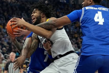 Marquette forward David Joplin (23) drives between Seton Hall forward Sadraque NgaNga (7) and center Elijah Hutchins-Everett (4) during the first half of their game Saturday, January 27, 2024 at Fiserv Forum in Milwaukee, Wisconsin.Mark Hoffman/Milwaukee Journal Sentinel