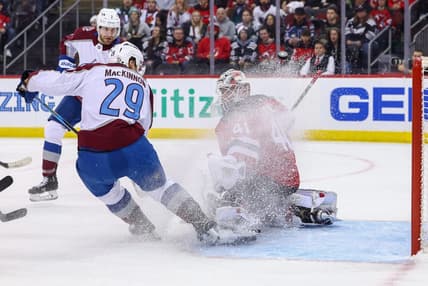 Feb 6, 2024; Newark, New Jersey, USA; New Jersey Devils goaltender Vitek Vanecek (41) makes a save on Colorado Avalanche center Nathan MacKinnon (29) during the first period at Prudential Center. Mandatory Credit: Ed Mulholland-USA TODAY Sports