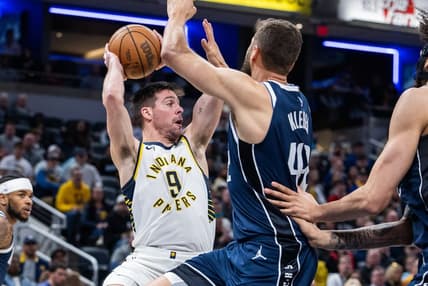 Feb 25, 2024; Indianapolis, Indiana, USA; Indiana Pacers guard T.J. McConnell (9) passes the ball while Dallas Mavericks forward Maxi Kleber (42) defends in the first half at Gainbridge Fieldhouse. Mandatory Credit: Trevor Ruszkowski-USA TODAY Sports