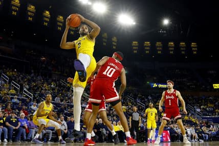 Mar 10, 2024; Ann Arbor, Michigan, USA;  Michigan Wolverines forward Tray Jackson (2) grabs the rebound over Nebraska Cornhuskers guard Jamarques Lawrence (10) in the first half at Crisler Center. Mandatory Credit: Rick Osentoski-USA TODAY Sports