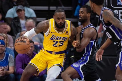 Mar 13, 2024; Sacramento, California, USA; Sacramento Kings forward Harrison Barnes (40) defends against Los Angeles Lakers forward LeBron James (23) during the fourth quarter at Golden 1 Center. Mandatory Credit: Ed Szczepanski-USA TODAY Sports