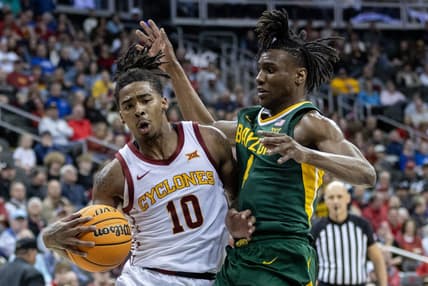 Mar 15, 2024; Kansas City, MO, USA; Iowa State Cyclones guard Keshon Gilbert (10) drives around Baylor Bears guard Ja'Kobe Walter (4) during the first half at T-Mobile Center. Mandatory Credit: William Purnell-USA TODAY Sports