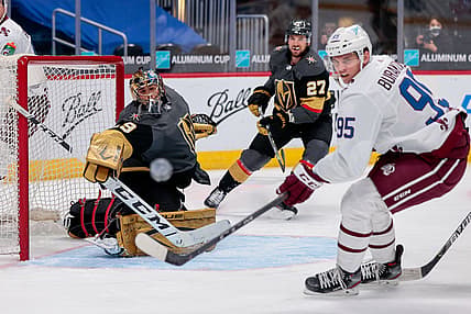 Feb 22, 2021; Denver, Colorado, USA; Vegas Golden Knights goaltender Marc-Andre Fleury (29) and Colorado Avalanche left wing Andre Burakovsky (95) watch as the puck is deflected wide of the net in the first period at Ball Arena. Mandatory Credit: Isaiah J. Downing-USA TODAY Sports