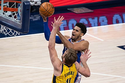 May 11, 2021; Indianapolis, Indiana, USA; Philadelphia 76ers forward Tobias Harris (12) shoots the ball while Indiana Pacers forward Domantas Sabonis (11) defends in the third quarter at Bankers Life Fieldhouse. Mandatory Credit: Trevor Ruszkowski-USA TODAY Sports