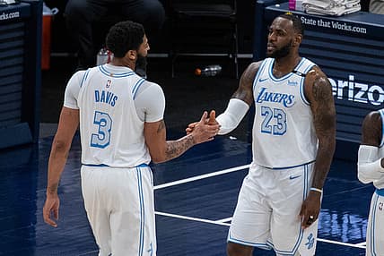 May 15, 2021; Indianapolis, Indiana, USA; Los Angeles Lakers forward LeBron James (23) gets a high five from forward Anthony Davis (3) after a foul in the second quarter against the Indiana Pacers at Bankers Life Fieldhouse. Mandatory Credit: Trevor Ruszkowski-USA TODAY Sports