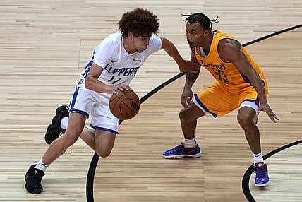 Aug 13, 2021; Las Vegas, Nevada, USA; LA Clippers guard Jason Preston (17) dribbles against Los Angeles Lakers guard Justin Robinson (55) during an NBA Summer League game at Thomas & Mack Center. Mandatory Credit: Stephen R. Sylvanie-USA TODAY Sports