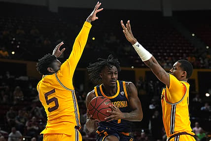 Mar 3, 2022; Tempe, Arizona, USA; California Golden Bears guard Joel Brown (1) drives against Arizona State Sun Devils guard Jay Heath (5) and Arizona State Sun Devils guard Luther Muhammad (1) during the first half at Desert Financial Arena. Mandatory Credit: Joe Camporeale-USA TODAY Sports