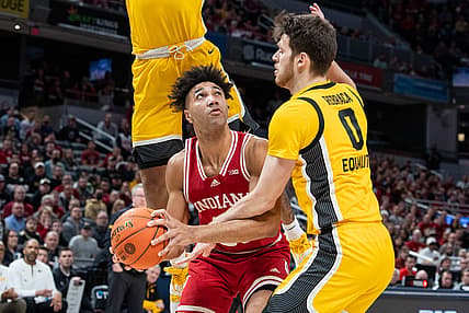Mar 12, 2022; Indianapolis, IN, USA;  Indiana Hoosiers forward Trayce Jackson-Davis (23) shoots the ball while Iowa Hawkeyes forward Filip Rebraca (0) defends  in the first half at Gainbridge Fieldhouse. Mandatory Credit: Trevor Ruszkowski-USA TODAY Sports