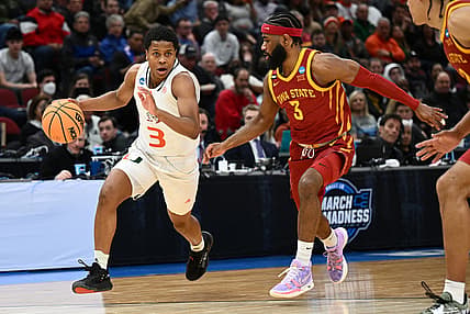 Mar 25, 2022; Chicago, IL, USA; Miami Hurricanes guard Charlie Moore (3) dribbles past Iowa State Cyclones guard Tre Jackson (3) during the first half in the semifinals of the Midwest regional of the men's college basketball NCAA Tournament at United Center. Mandatory Credit: Jamie Sabau-USA TODAY Sports