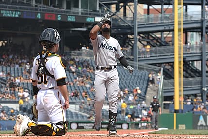 Jul 24, 2022; Pittsburgh, Pennsylvania, USA;  Miami Marlins right fielder Bryan De La Cruz (14) crosses home plate on a solo home run against the Pittsburgh Pirates during the fifth inning at PNC Park. Mandatory Credit: Charles LeClaire-USA TODAY Sports