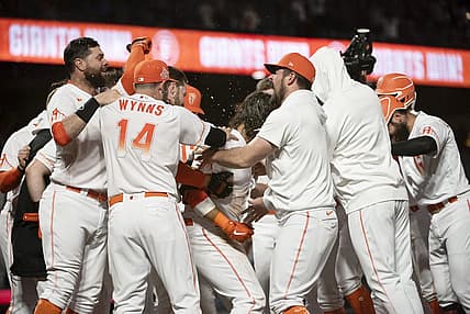 Aug 16, 2022; San Francisco, California, USA; San Francisco Giants shortstop Brandon Crawford (35) celebrates with team mates after hitting a walk off two-run home run during the ninth inning against the Arizona Diamondbacks at Oracle Park. Mandatory Credit: Ed Szczepanski-USA TODAY Sports