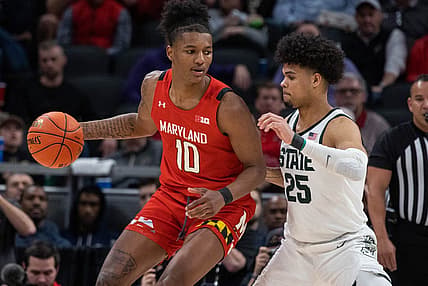 Mar 10, 2022; Indianapolis, IN, USA; Maryland Terrapins forward Julian Reese (10) dribbles the ball while Michigan State Spartans forward Malik Hall (25) defends in the second half at Gainbridge Fieldhouse. Mandatory Credit: Trevor Ruszkowski-USA TODAY Sports