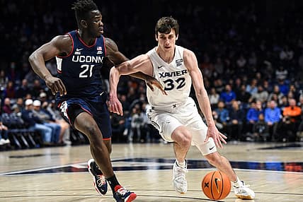 Xavier's Zach Freemantle takes the ball down the court during the game between Xavier and Uconn at Cintas Center on Friday February 11, 2022. Xavier lead the game at halftime with a score of 34-31.