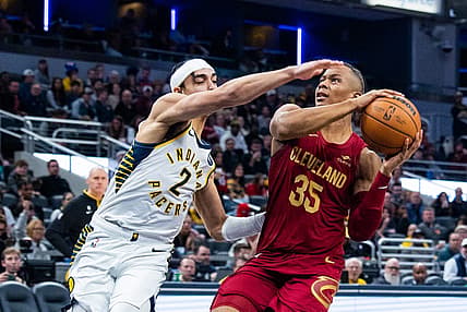 Feb 5, 2023; Indianapolis, Indiana, USA; Cleveland Cavaliers forward Isaac Okoro (35) shoots the ball while Indiana Pacers guard Andrew Nembhard (2)  defends in the second half at Gainbridge Fieldhouse. Mandatory Credit: Trevor Ruszkowski-USA TODAY Sports