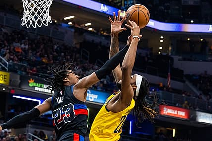 Apr 7, 2023; Indianapolis, Indiana, USA; Indiana Pacers forward Isaiah Jackson (22) shoots the ball while  Detroit Pistons guard Jaden Ivey (23) defends in the first half at Gainbridge Fieldhouse. Mandatory Credit: Trevor Ruszkowski-USA TODAY Sports