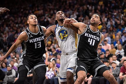 Apr 7, 2023; Sacramento, California, USA; Sacramento Kings forward Keegan Murray (13) and forward Trey Lyles (41) fight for position under the basket with Golden State Warriors forward Kevon Looney (5) during the third quarter at Golden 1 Center. Mandatory Credit: Ed Szczepanski-USA TODAY Sports