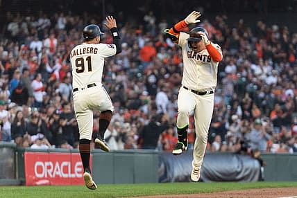 Sep 10, 2023; San Francisco, California, USA;  San Francisco Giants designated hitter Joc Pederson (23) celebrates with third base coach Mark Hallberg (91) after hitting a solo home run during the fifth inning against the Colorado Rockies at Oracle Park. Mandatory Credit: Stan Szeto-USA TODAY Sports