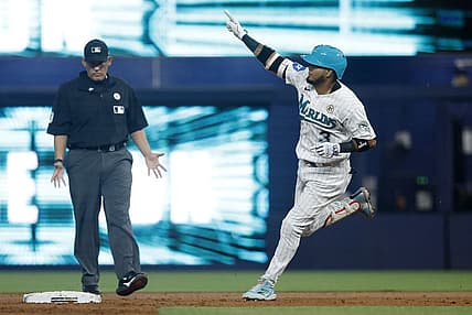 Sep 15, 2023; Miami, Florida, USA; Miami Marlins second baseman Luis Arraez (3) hits a home run against the Atlanta Braves during the first inning at loanDepot Park. Mandatory Credit: Rhona Wise-USA TODAY Sports