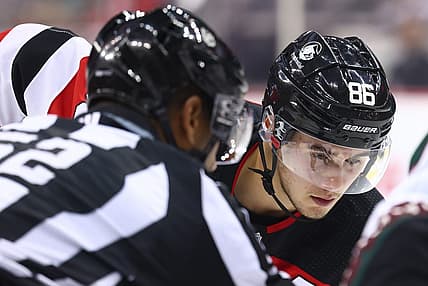 Oct 13, 2023; Newark, New Jersey, USA; New Jersey Devils center Jack Hughes (86) gets ready to face-off against the Arizona Coyotes during the second period at Prudential Center. Mandatory Credit: Ed Mulholland-USA TODAY Sports