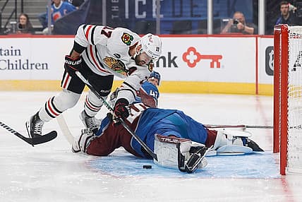 Oct 19, 2023; Denver, Colorado, USA; Colorado Avalanche goaltender Alexandar Georgiev (40) makes a save against Chicago Blackhawks left wing Nick Foligno (17) in the first period at Ball Arena. Mandatory Credit: Isaiah J. Downing-USA TODAY Sports