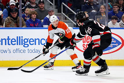 Nov 3, 2023; Buffalo, New York, USA;  Philadelphia Flyers right wing Bobby Brink (10) looks to make a pass as Buffalo Sabres defenseman Owen Power (25) defends during the first period at KeyBank Center. Mandatory Credit: Timothy T. Ludwig-USA TODAY Sports