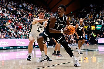 Feb 17, 2024; Fort Collins, Colorado, USA; Utah State Aggies forward Great Osobor (1) controls the ball against Colorado State Rams forward Patrick Cartier (12) in the first half at Moby Arena. Mandatory Credit: Isaiah J. Downing-USA TODAY Sports
