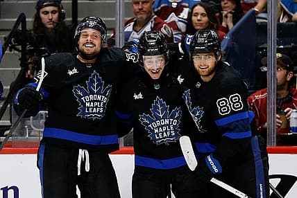 Feb 24, 2024; Denver, Colorado, USA; Toronto Maple Leafs left wing Tyler Bertuzzi (59) celebrates his hat trick goal with center Auston Matthews (34) and right wing William Nylander (88) in the third period against the Colorado Avalanche at Ball Arena. Mandatory Credit: Isaiah J. Downing-USA TODAY Sports
