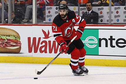 Mar 10, 2020; Newark, New Jersey, USA; New Jersey Devils right wing Kyle Palmieri (21) skates with the puck against the Pittsburgh Penguins during the second period at Prudential Center. Mandatory Credit: Ed Mulholland-USA TODAY Sports