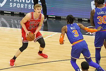 Feb 3, 2021; Chicago, Illinois, USA;  Chicago Bulls forward Lauri Markkanen (24) dribbles the ball against New York Knicks center Nerlens Noel (3) during the first quarter at the United Center. Mandatory Credit: Mike Dinovo-USA TODAY Sports