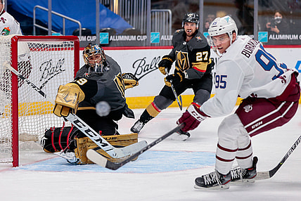 Feb 22, 2021; Denver, Colorado, USA; Vegas Golden Knights goaltender Marc-Andre Fleury (29) and Colorado Avalanche left wing Andre Burakovsky (95) watch as the puck is deflected wide of the net in the first period at Ball Arena. Mandatory Credit: Isaiah J. Downing-USA TODAY Sports